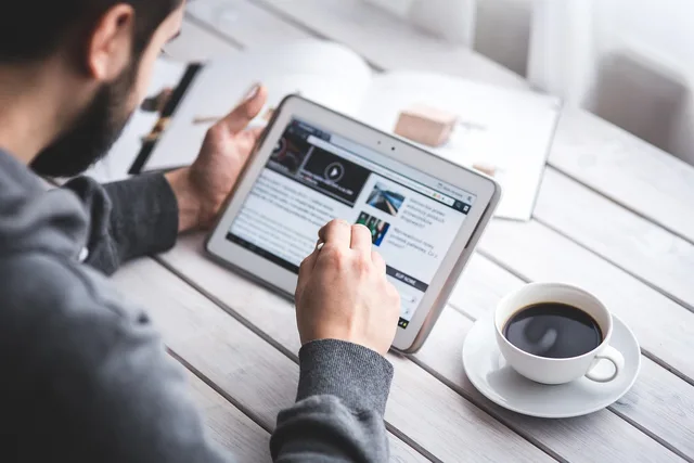 man, reading, touchscreen, blog, digital, tablet, coffee cup, working, screen, touching, touch, samsung, stylus, pen, technology, device, coffee, cup. Landing page software operations: gates and rollback